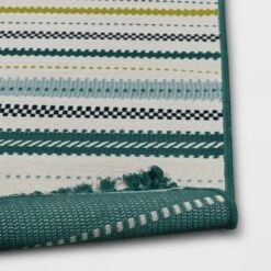 5'x7' Textural Stripe Rectangular Woven Outdoor Area Rug Light Green - Threshold™ -Threshold GUEST f007cad1 6d19 4860 a2d7 527203ce29f5